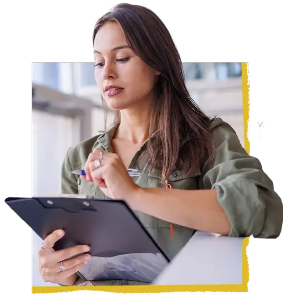 Woman writing on a clipboard